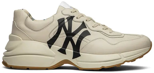 Gucci Rhyton Leather 'NY Yankees' sneakers with iconic logo and chunky sole.