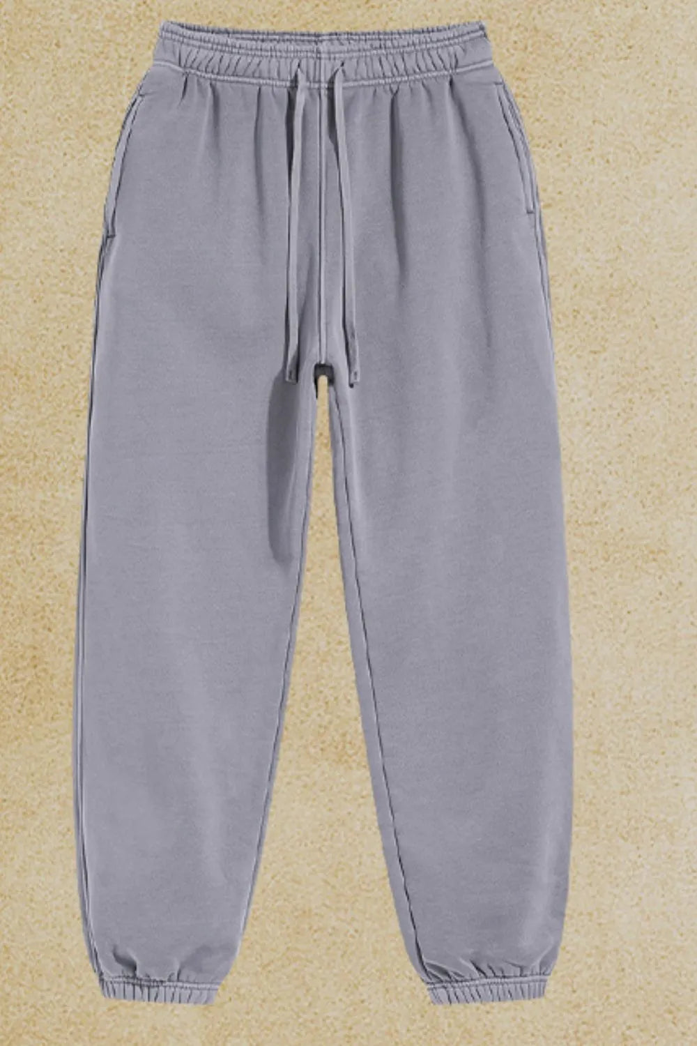 Men's drawstring joggers with pockets made of cotton-polyester blend.