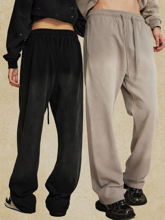 Men's drawstring baggy pants in black and beige, featuring basic style and relaxed fit.