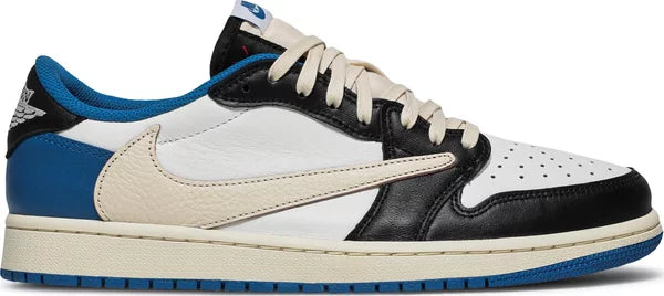 Fragment Design x Travis Scott Air Jordan 1 Retro Low for Kids, white leather, black and blue overlays, inverted Swoosh, Cactus Jack branding.