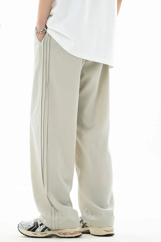 Men's plus size drawstring loose fit pants in light fabric.