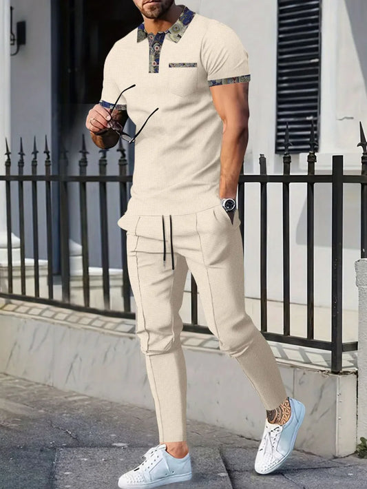 Men's full-size waffle knit short sleeve polo and pants set in beige, featuring buttons, a pocket, and drawstring waist, suitable for plus-size.