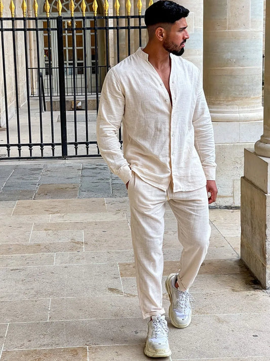 Men's button up long sleeve top and pants set in white cotton.