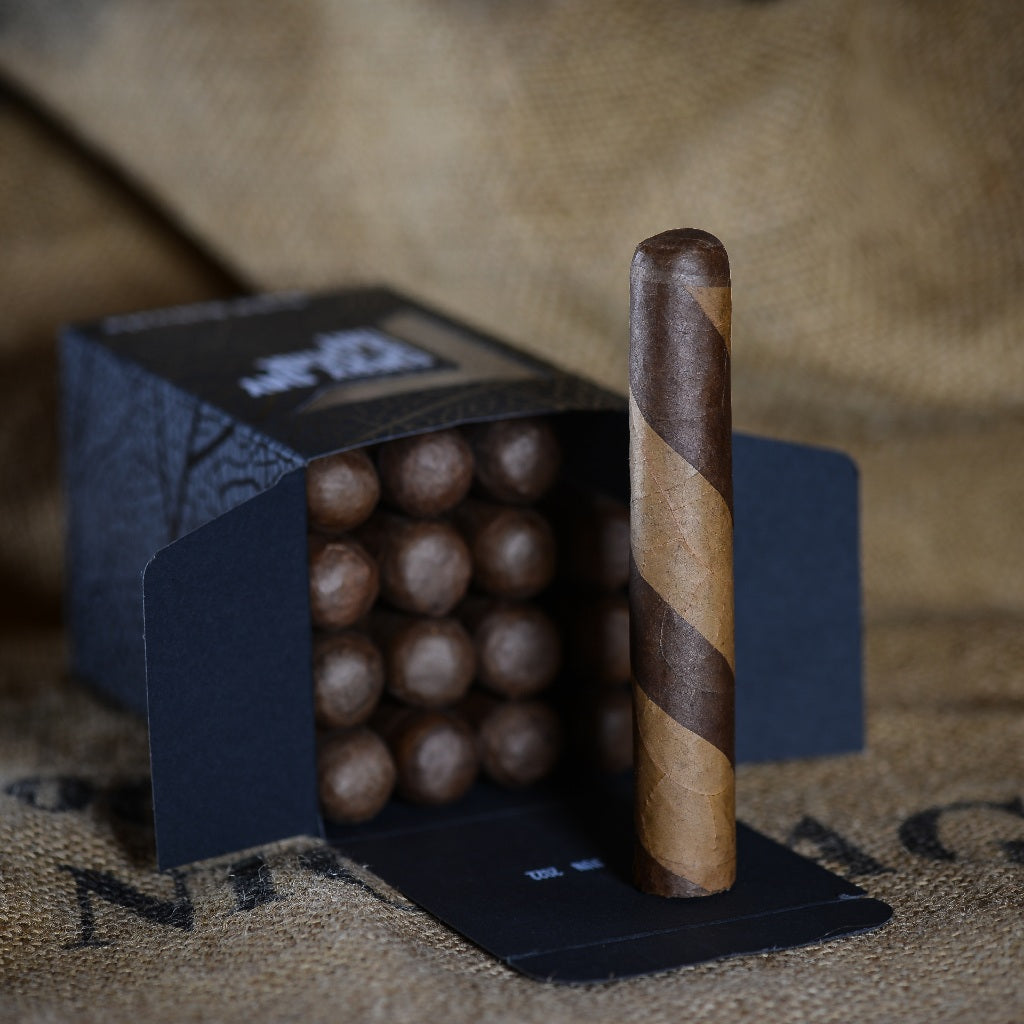 Robusto Barber Pole cigar in open box of 16, featuring distinct dual-color wrapper.