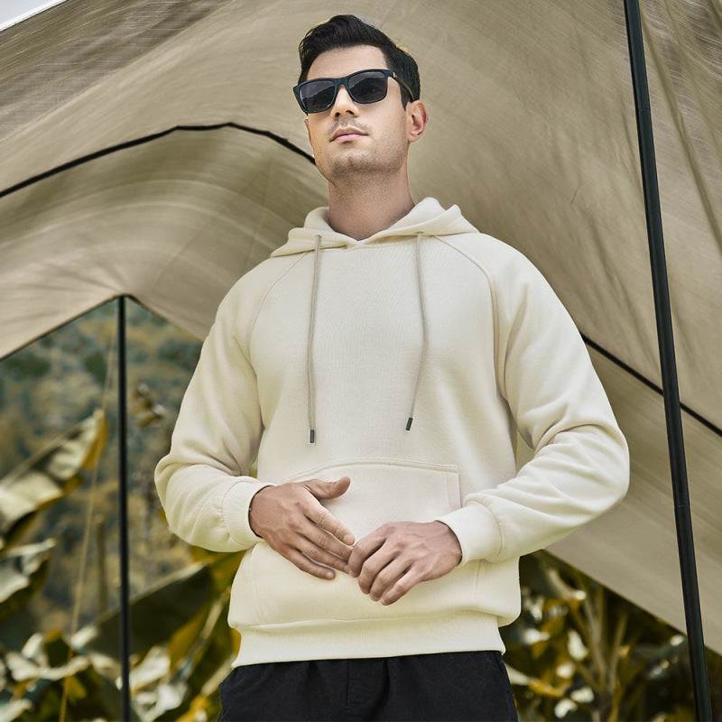 Casual solid color men's hooded sweatshirt, perfect for all-season fashion, featuring premium polyester blend and functional pockets.