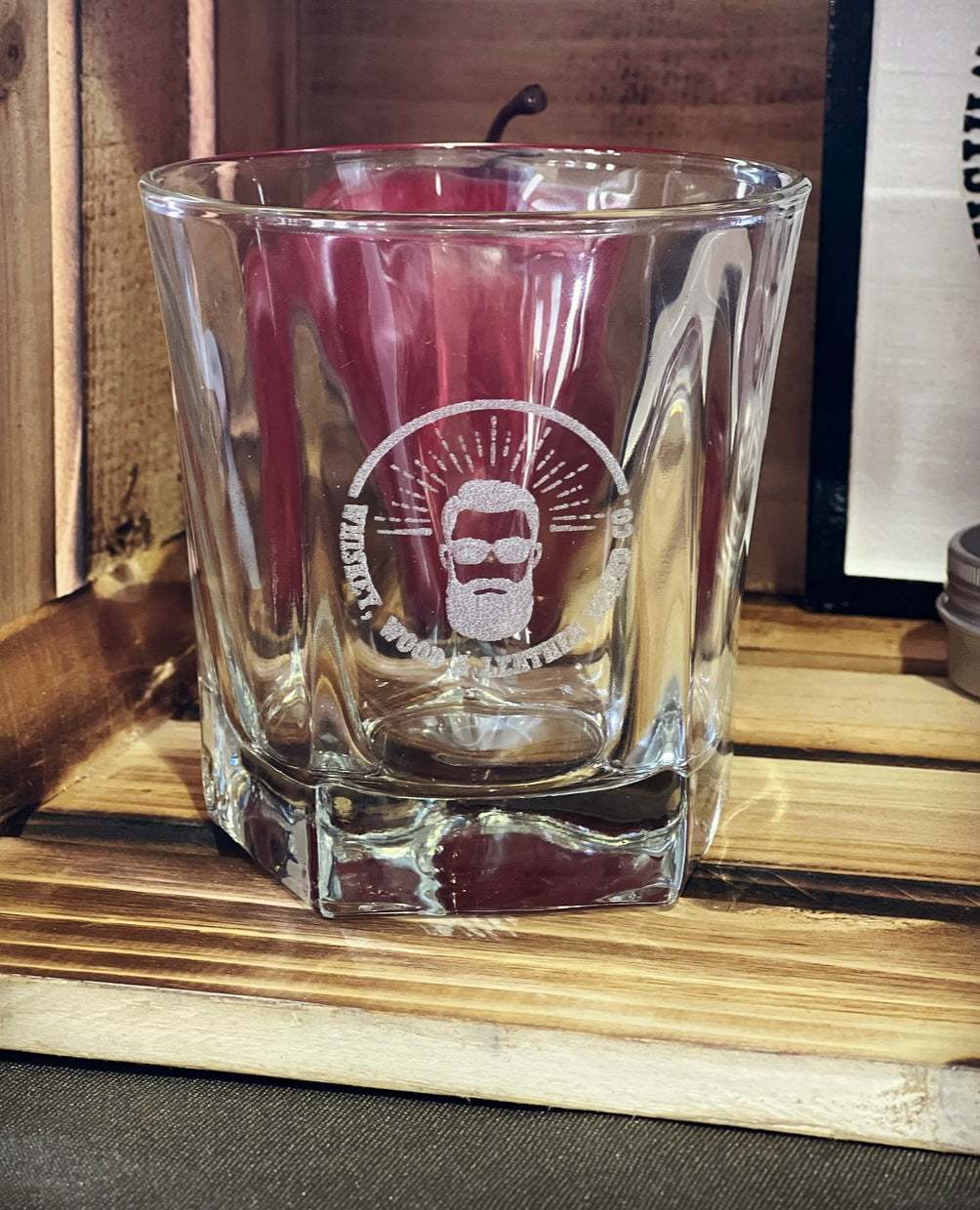 Bourbon Whiskey faceted glass 12 oz. with classic design on wooden surface.