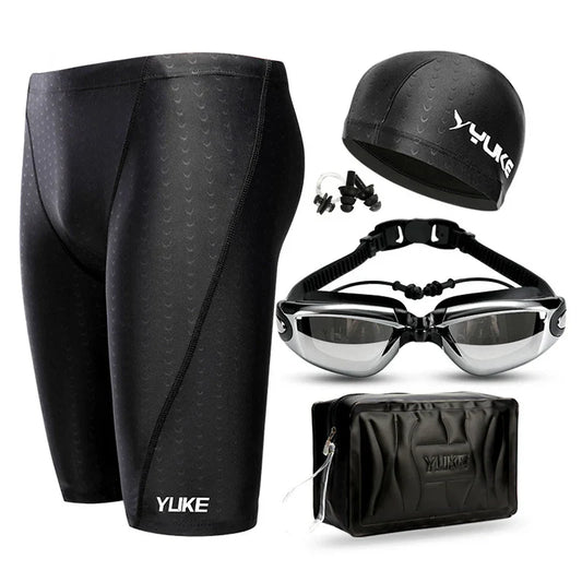Men's swim shorts set with waterproof goggles, ear-plug cap, and shark skin design.