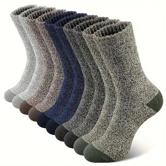 Men's super thick hiking socks in assorted colors, made from Merino wool, ideal for cold weather adventures.