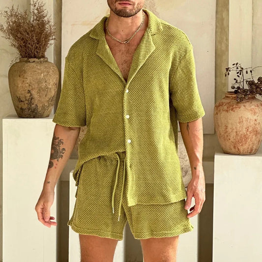 Luxury men's beach wear set with short sleeves, featuring single-breasted and drawstring closures, in a solid pattern.