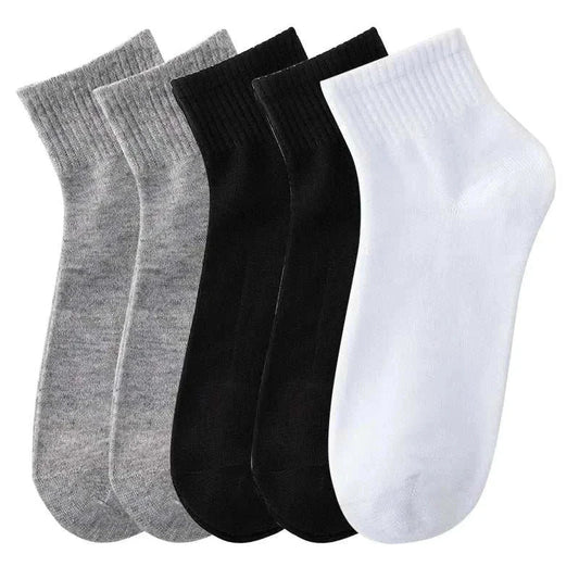 5 pairs of men's solid color socks in breathable cotton for business and casual wear.