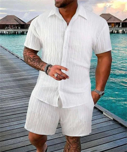 Irie men beach shorts set in white by the ocean, featuring a breathable and stylish design.