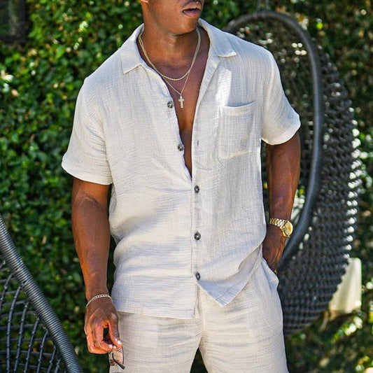Men's beach shorts set with short sleeves, solid pattern, and drawstring closure. Made of high-quality cotton, perfect for stylish casual occasions in spring and summer.