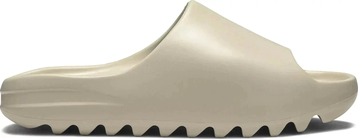 adidas Yeezy Slide 'Bone' with monochromatic Bone EVA foam upper and rugged sole.
