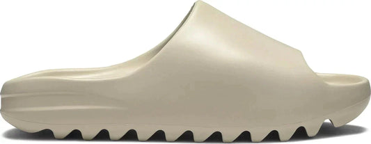 adidas Yeezy Slide 'Bone' with monochromatic Bone EVA foam upper and rugged sole.