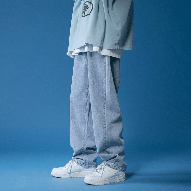 Unisex Loose Fit Denim Jeans in blue shade, featuring a relaxed silhouette and mid-rise waist, ideal for versatile and comfortable everyday wear.