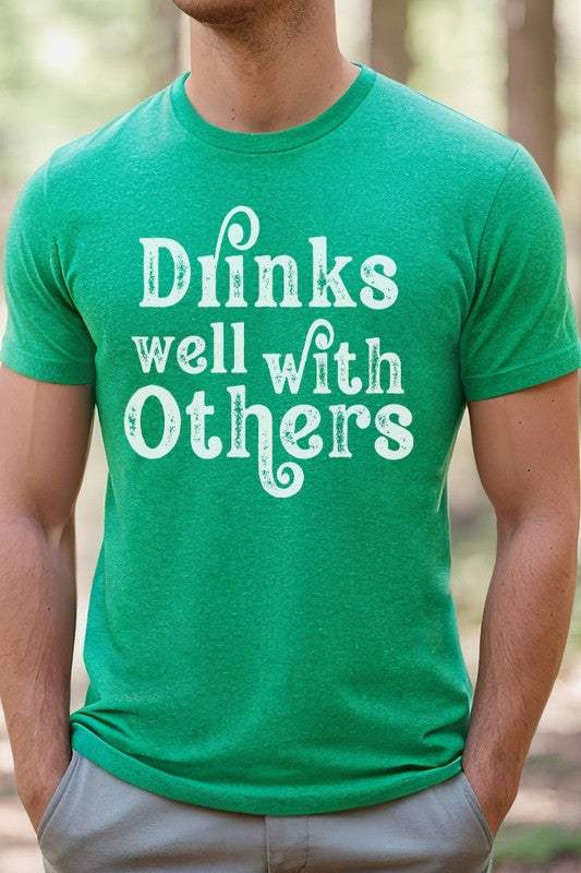 St Patrick's Day Drinks Well With Others green tee featuring a durable screen-printed design.