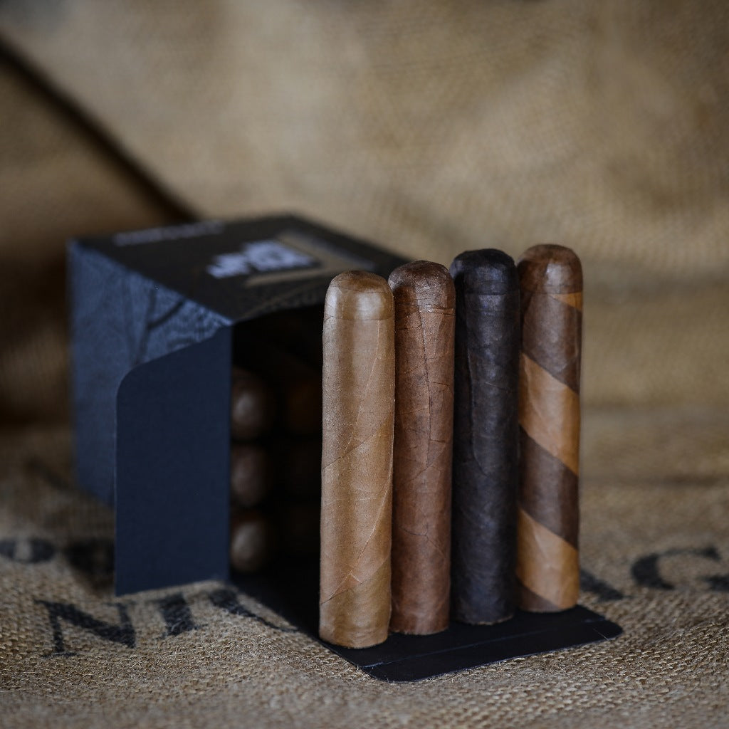 Box of 16 cigars featuring a 4x48 Pablito Sampler with a variety of premium wrappers including Connecticut, Ecuadorian Habano, and Barber Pole.