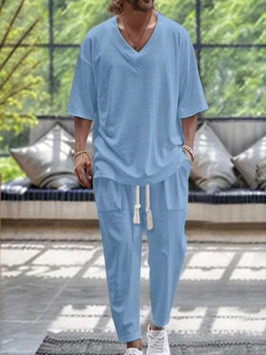 Men's V-Neck Half Sleeve Top and Pants Set in light blue, comfortable and slightly stretchy, made of cotton and polyester.