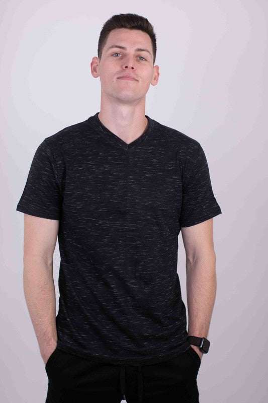 Man wearing Essential Softness V-Neck Tee in black, showcasing tailored fit and comfort.