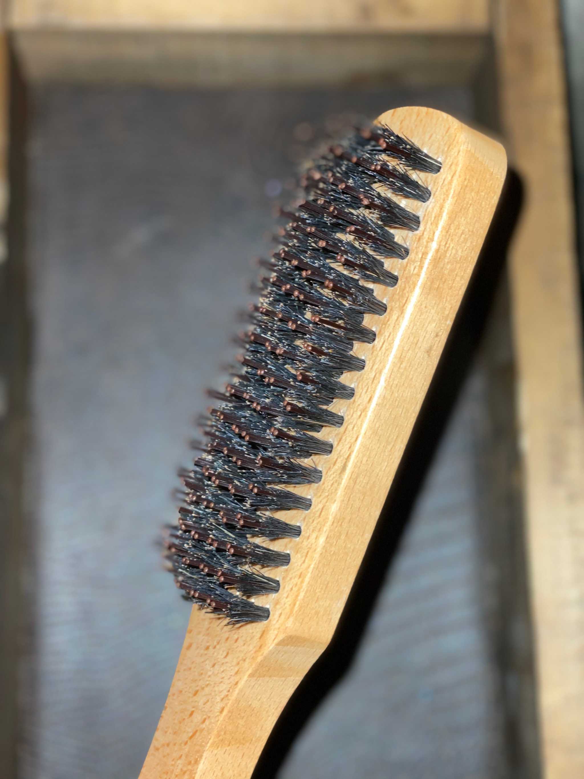 Wooden handle boar hair beard brush with nylon bristles.