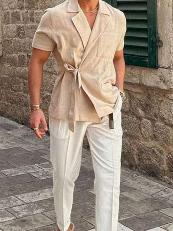 Men's solid color linen blend short-sleeve shirt with tie waist, styled for spring/summer.