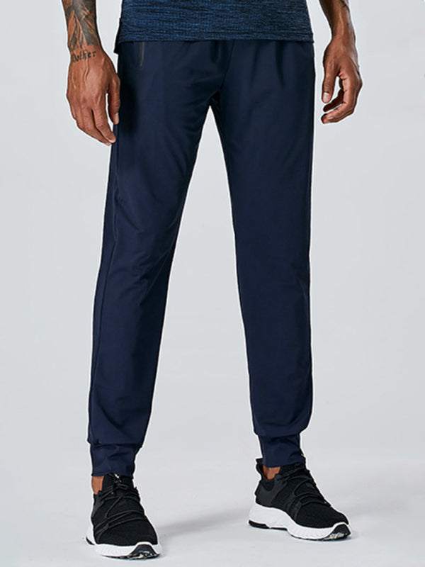 Men's quick-dry fitness elastic zipper pants in navy blue.