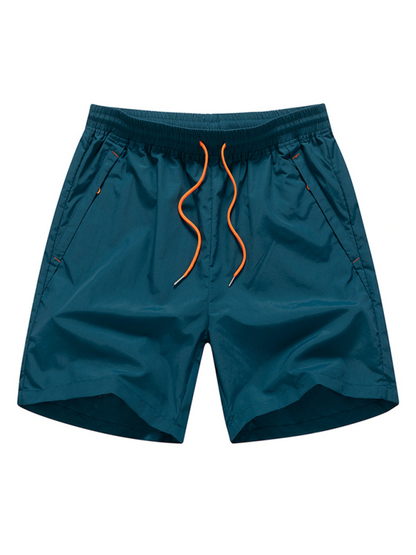 Men's quick-dry beach shorts, lightweight and sporty with an elastic waistband and slant pockets.