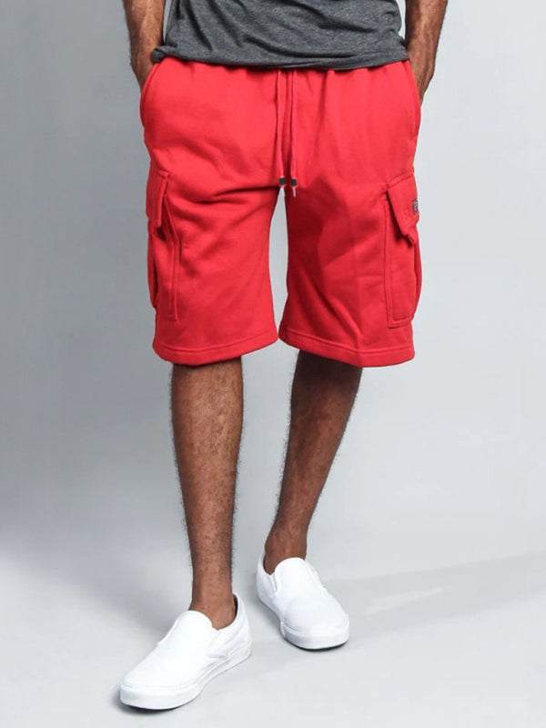 Men’s casual red cargo shorts with multi-pockets, showcasing loose-fit style.