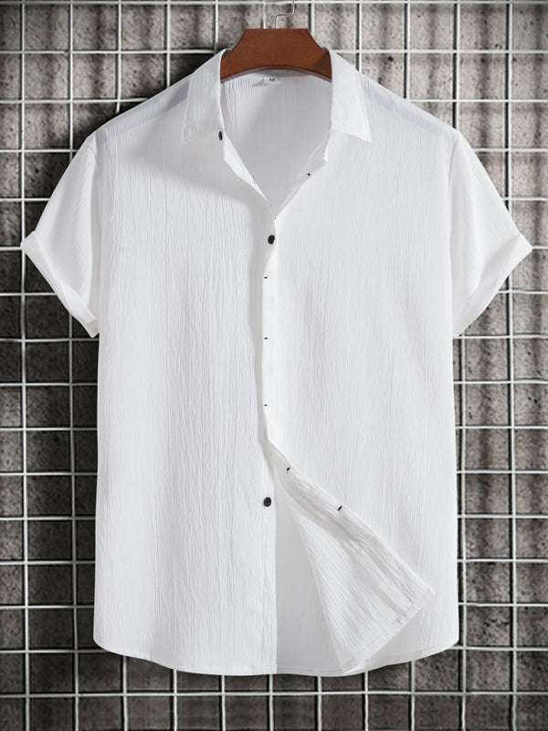 Men's white short sleeve loose solid color button cotton linen shirt hanging.