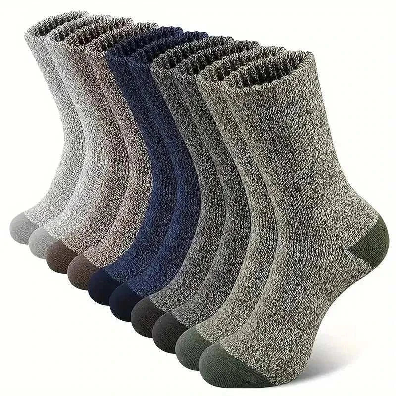 Men's super thick hiking socks in assorted colors, made from Merino wool, ideal for cold weather adventures.