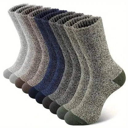 Men's super thick hiking socks in assorted colors, made from Merino wool, ideal for cold weather adventures.