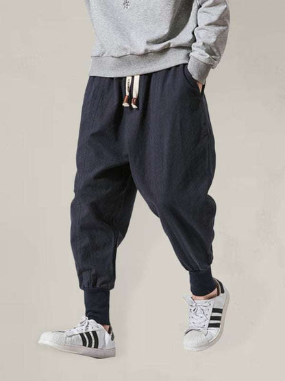 Chic linen hip hop breathable cotton trousers in solid color for men.