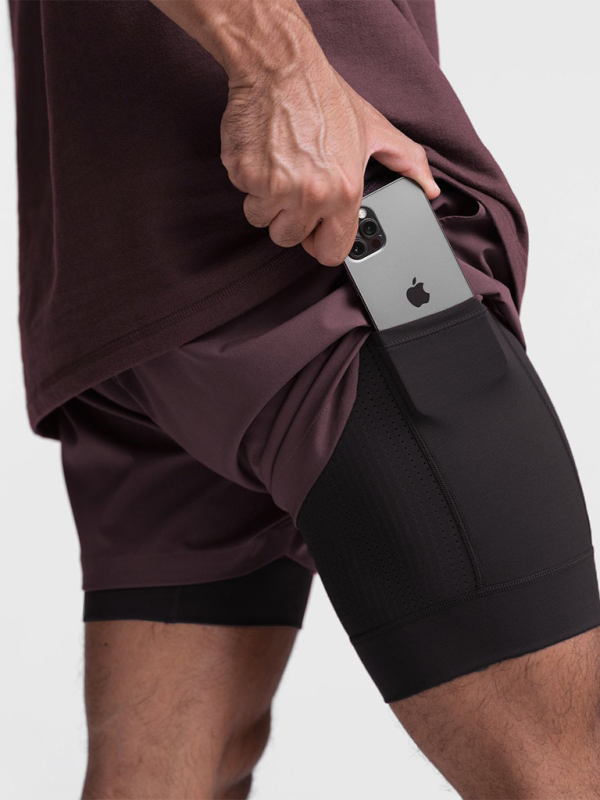 Double-layer breathable basketball shorts with phone pocket for training and sports.