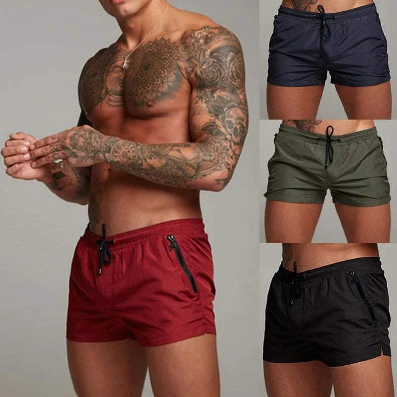 Mens swim trunks with zipper pockets and mesh liner in multiple colors.