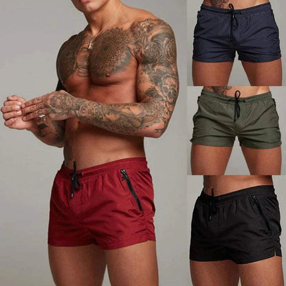 Mens swim trunks with zipper pockets and mesh liner in multiple colors.