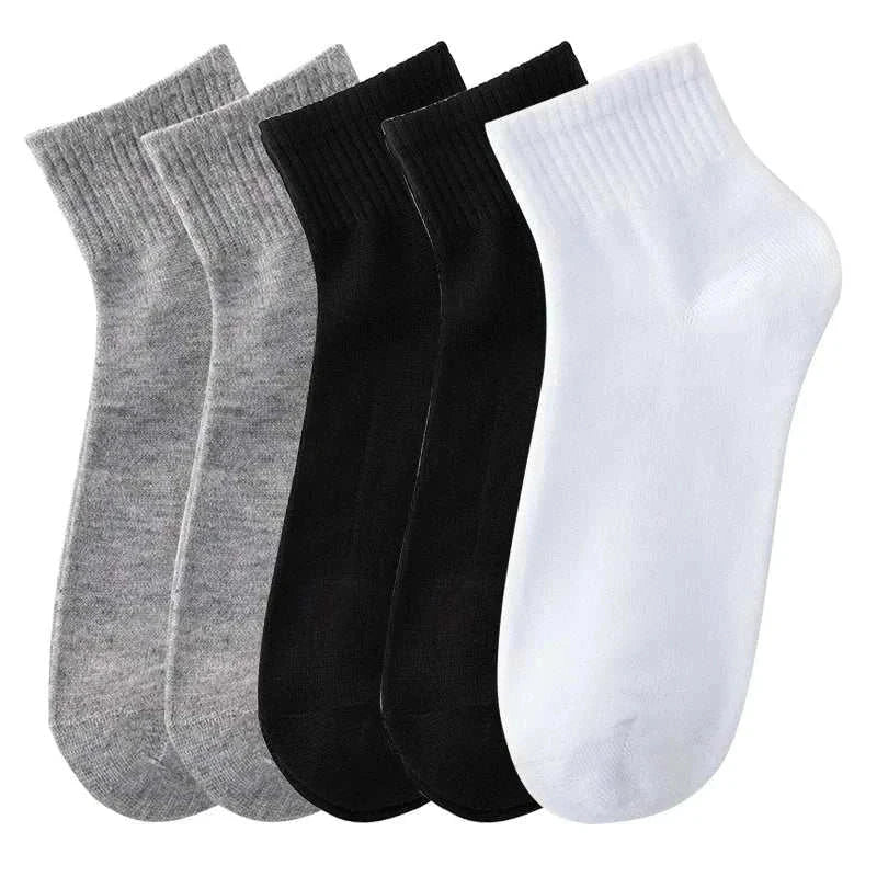 5 pairs of men's solid color socks in breathable cotton for business and casual wear.