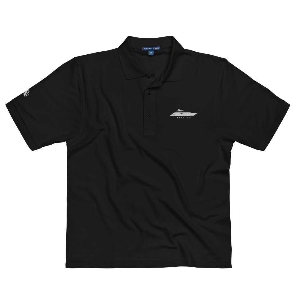 Men's black premium polo with embroidered logo, featuring relaxed fit and flat knit collar.