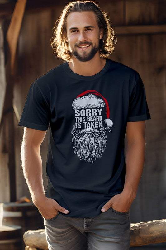 Christmas Graphic Tee with "Sorry This Beard is Taken" text, featuring a Santa hat design, ideal for festive occasions.