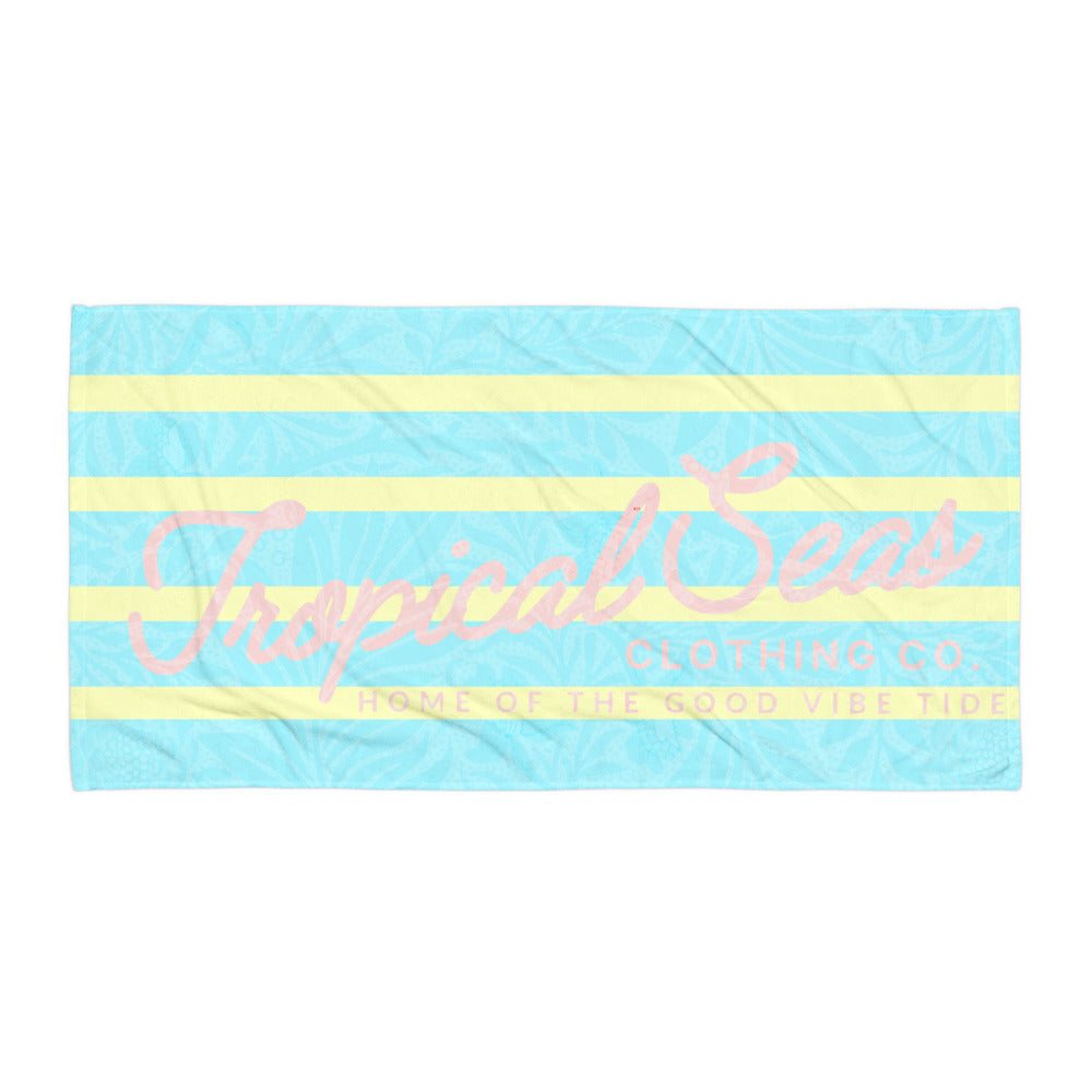 Tropical Vibes Beach Towel with blue and yellow stripes and pink Tropical Seas logo design