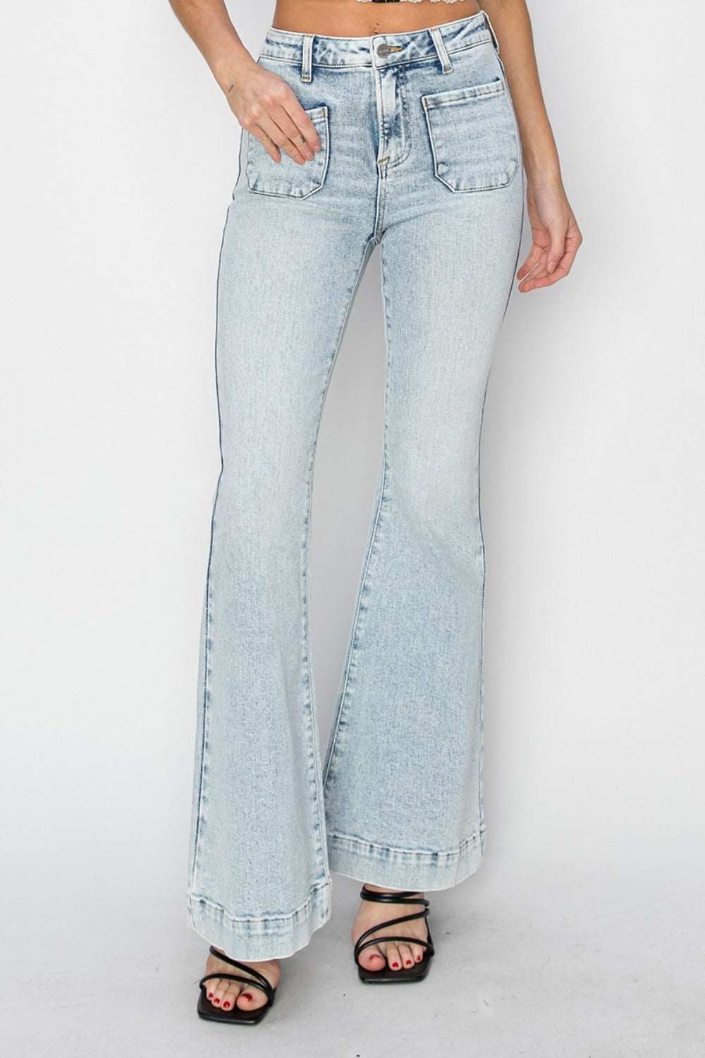Full size high rise flare jeans with front patch pockets in light denim.