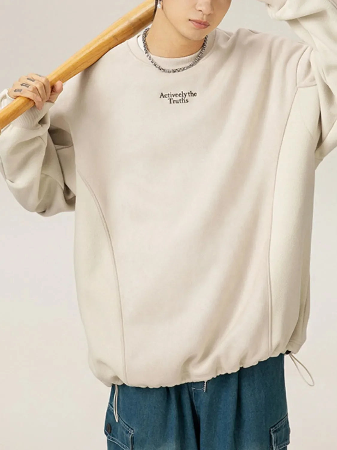 Men's drawstring round neck long sleeve sweatshirt in beige with casual style.