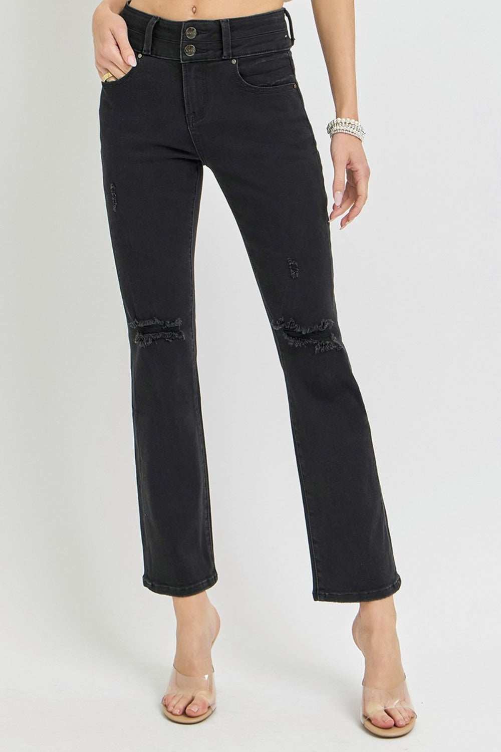 Full size high-rise black bootcut jeans with wide waistband and ankle length.