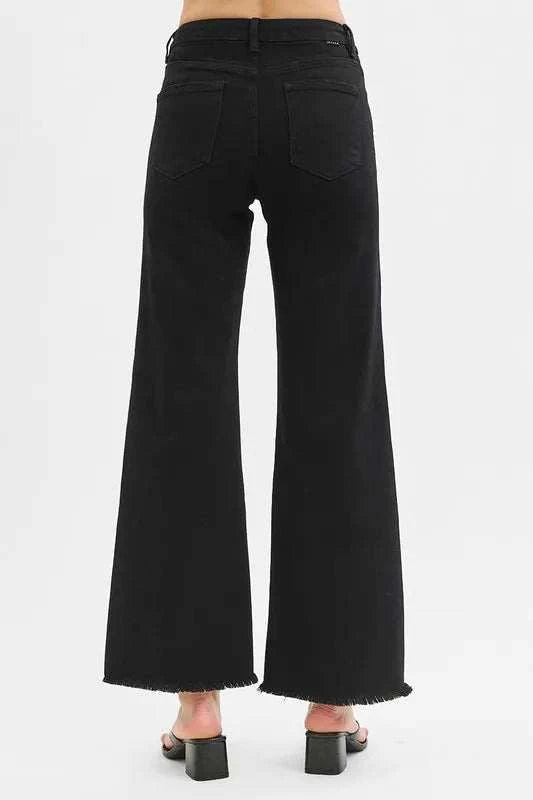 Wide-leg jeans with high-rise waist and tummy control, back view with raw hem detailing.