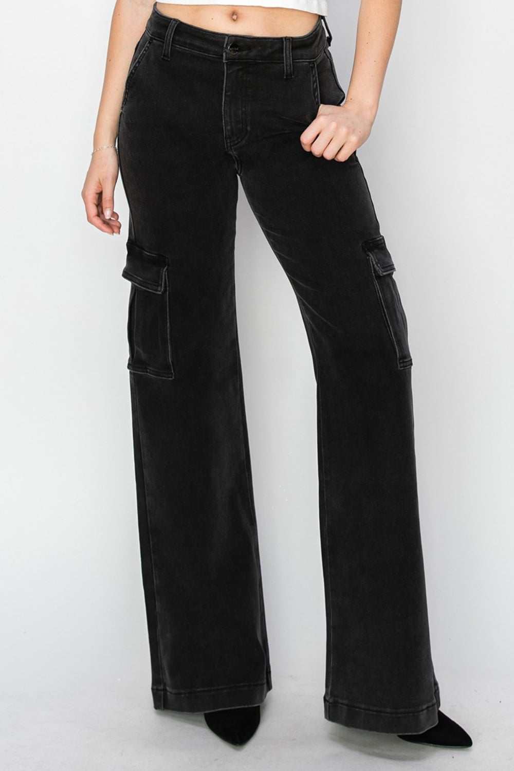 High-rise wide leg cargo jeans with utilitarian pockets and relaxed fit.