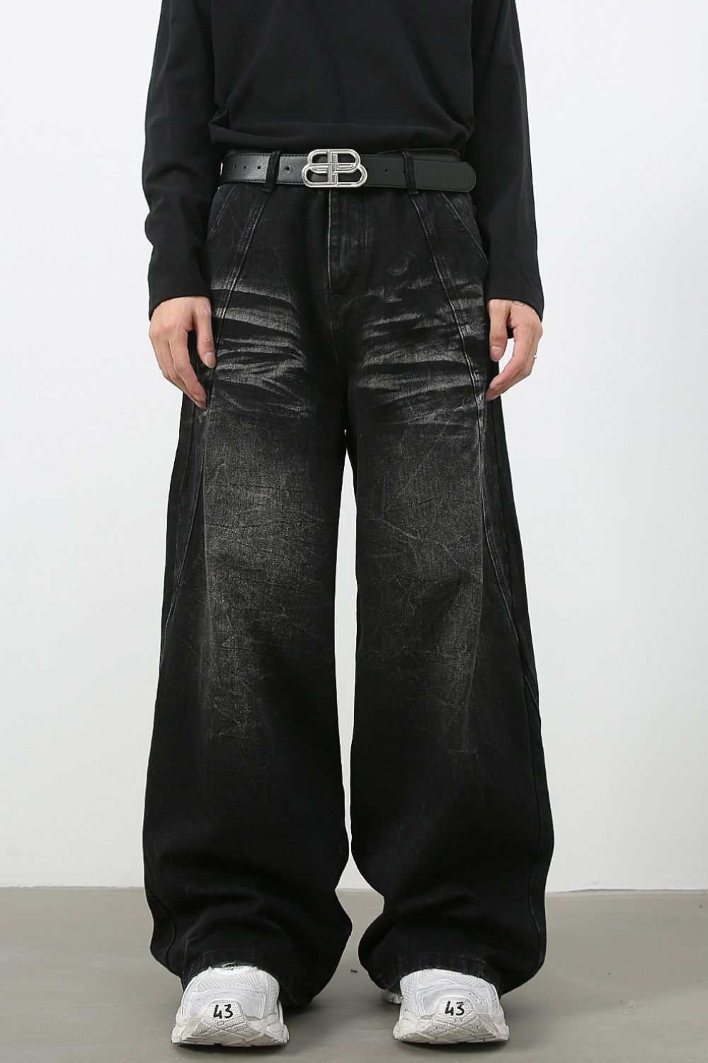 Men's wide leg jeans with pockets and cat's whisker detailing.