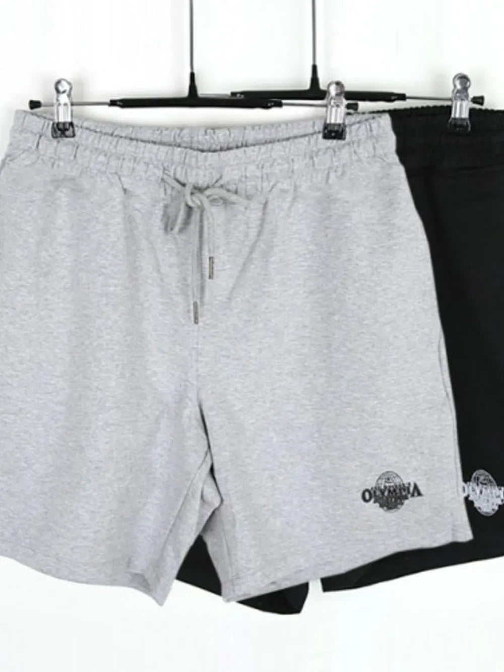 Men's drawstring shorts in grey and black, basic style with elastic waist.