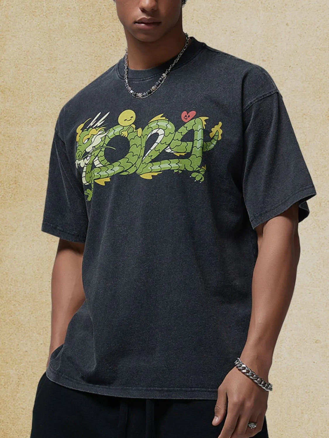 Men's graphic round neck half sleeve t-shirt in black with colorful design.