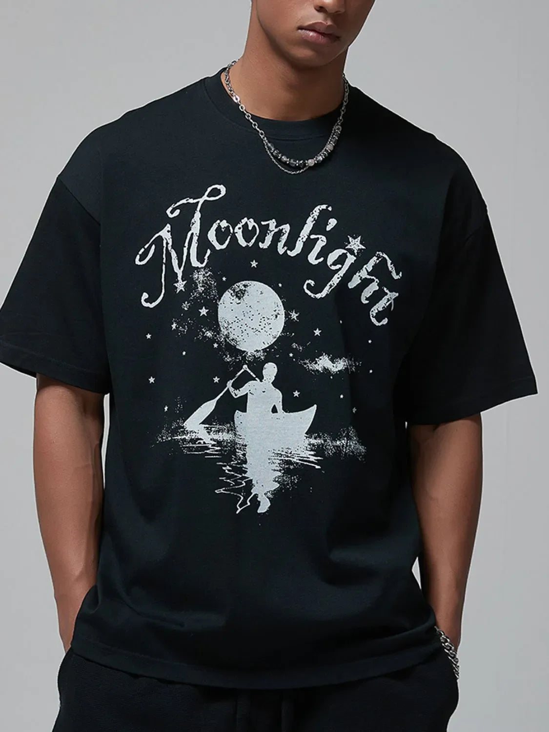 Men's graphic round neck half sleeve T-shirt with 'Moonlight' print in front.