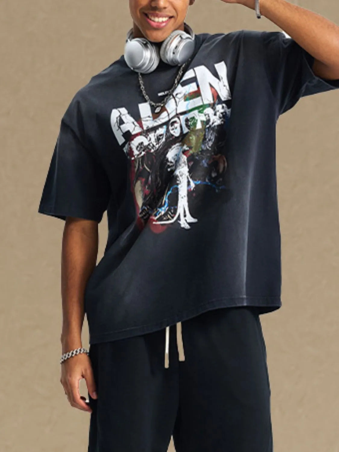 Men's graphic round neck half sleeve t-shirt in black with colorful front design.