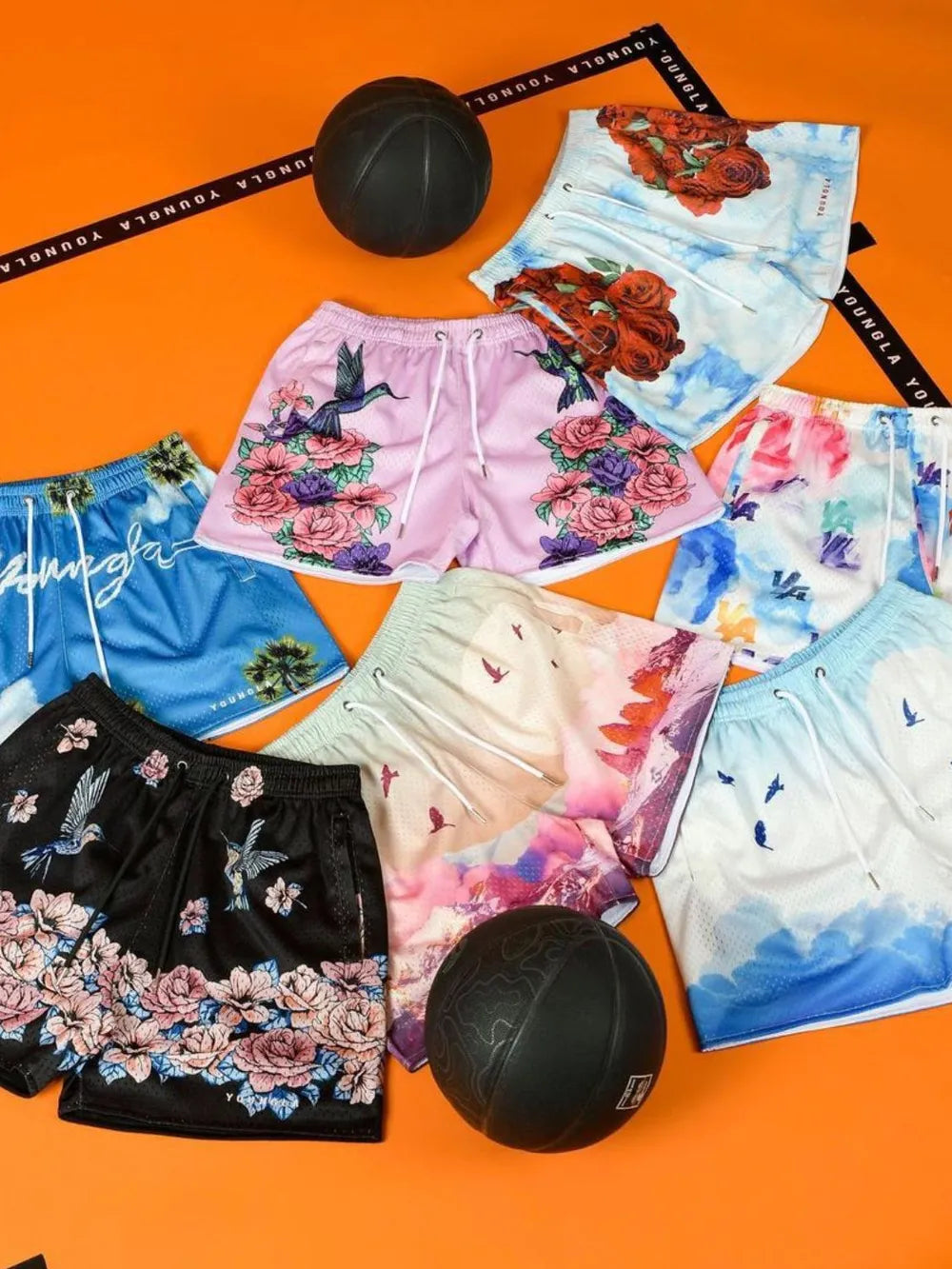 Men's plus size drawstring printed shorts with vibrant designs displayed with basketballs.